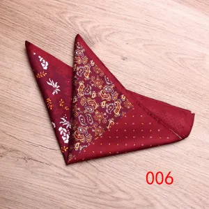 Detailed view of men's burgundy paisley pocket square, elegant printed silk handkerchief.