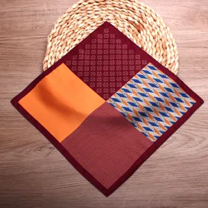 Detailed shot of mens stylish multi-color patchwork pocket square with classic print design.