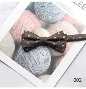 Men's stylish brown bow tie with blue floral pattern, perfect for formal business wear.