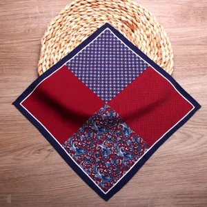 Detail shot of men's silk pocket square featuring classic paisley and geometric print patterns.