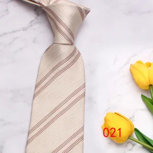 Detail view of classic men business casual striped tie in light color, fine fabric texture.