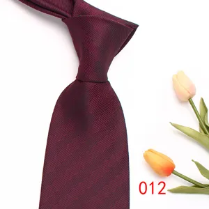 Men's business burgundy herringbone necktie detail shot, elegant fabric texture design.
