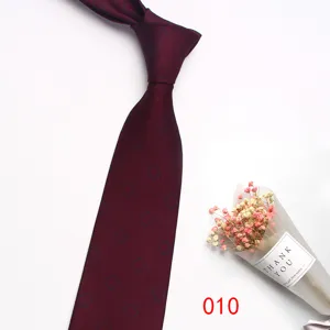 Burgundy men's business silk necktie with geometric pattern, formal wedding suit accessory.