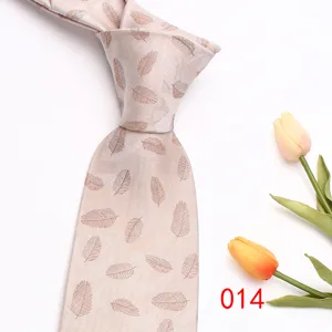 Elegant light-colored men business necktie with delicate leaf pattern for formal wear.