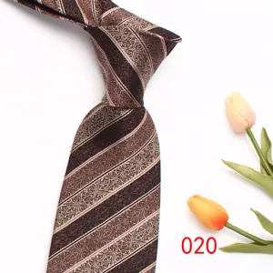 Detailed shot of brown mens paisley patterned business necktie showing fabric and stripe detail.