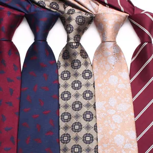 Detail view of woven polyester men business ties featuring classic stripe and floral patterns.