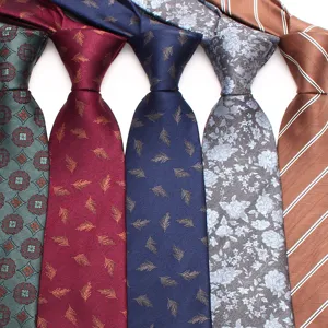 Close-up detail of multi-pattern business neckties showing fine fabric texture and prints.