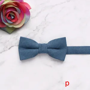 Blue fabric bow tie detail shot showcasing fine soft texture and neat stitching design.