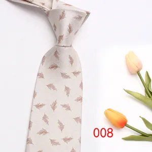 Detailed view of beige men necktie featuring elegant brown feather pattern fine fabric texture