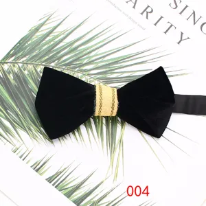 Detailed view of a classy black velvet bow tie with a gold striped center knot for formal suits.