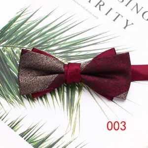 Close-up detail of the stylish burgundy double-layered men's bowtie with metallic texture.