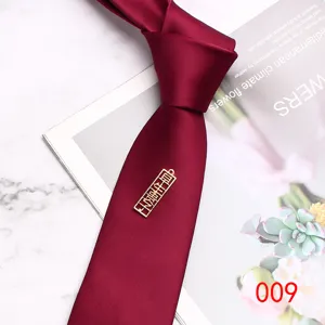 Burgundy mens wedding tie 7cm width polyester material with double happiness pendant detail.