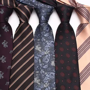 Detailed close-up view showcasing multiple stylish men's business ties with various elegant patterns.