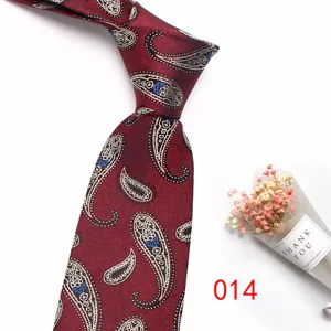 Red paisley silk jacquard necktie detail view, classic vintage business tie pattern.