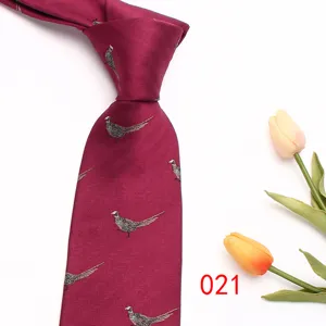 Close-up detail of wine red pheasant pattern jacquard tie showing delicate fabric texture.