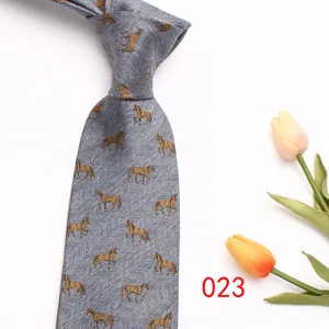 Grey herringbone necktie detail showcasing elegant woven gold horse patterns and fabric texture.