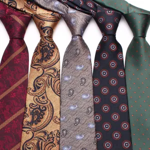 Detail view of men's vintage patterned neckties showcasing classic paisley and striped designs.
