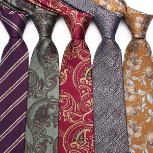 Detailed view of men classic patterned neckties featuring stripes and paisley designs.