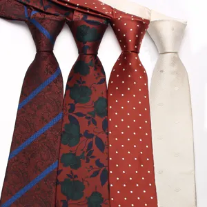 Classic men's silk tie collection featuring stylish paisley, floral, polka dot, and solid cream designs.