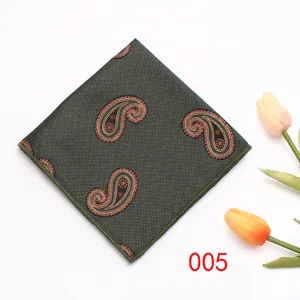 Green paisley pattern pocket square detail, elegant texture for formal business suit accessory.