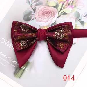 Classic men's double layer bow tie with vintage jacquard pattern, elegant formal accessory.