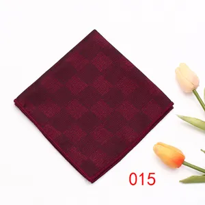 Luxury burgundy checkered pocket square detail, elegant men suit handkerchief formal accessory.