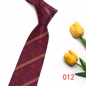 Detailed view of a stylish red paisley tie with golden diagonal stripes, classic 8cm width.