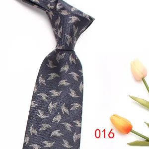 Men's business formal jacquard silk tie in dark blue with silver leaf pattern for office work.
