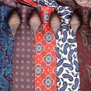 Detail shot of men's floral and paisley patterned neckties for formal events and business.