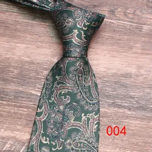Dark green paisley necktie detail shot, retro floral pattern fabric texture close up.