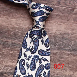 Detailed view of classic paisley patterned silk necktie with elegant blue floral design on white.