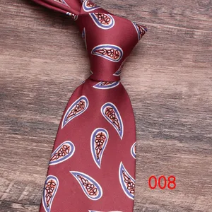 Men's wine red paisley necktie detail shot, classic floral pattern business casual neck tie.