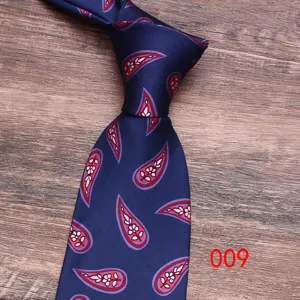 Classic blue paisley men's tie, elegant floral pattern necktie for business and formal events.