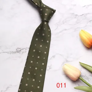 Green business necktie detail shot featuring classic pattern and elegant texture, perfect style.