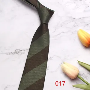 Detail view of men's green and brown striped business tie, textured polyester fabric.