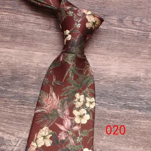 Close-up detail of a dark red floral print necktie with vintage botanical pattern design.