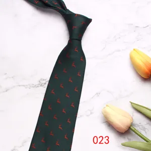 Close-up detail view of dark green men business tie featuring cute red deer pattern.