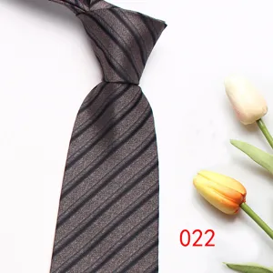Close-up detail view of mens business striped tie texture, classic diagonal pattern fabric.