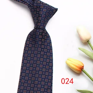 Men classic business suit tie detail, navy blue with geometric square pattern design.