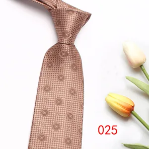 Brown patterned mens necktie detail close up shot, formal business suit wedding tie.
