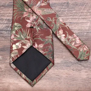 Detailed view of the brown floral print men tie, showing fine fabric texture and lining work.