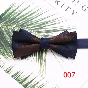 Detail shot of a stylish double-layer men's bow tie with blue and brown striped pattern.