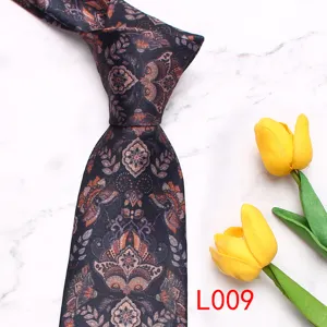 Detailed close-up view of men's vintage printed necktie featuring classic paisley floral pattern.