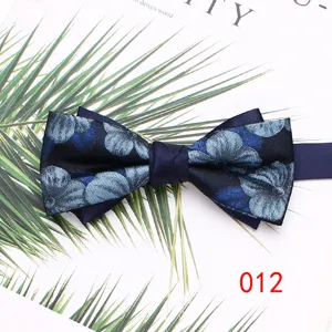 Detailed view of a stylish double layer blue floral men bow tie, perfect for weddings and events.