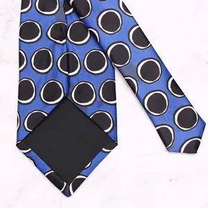 Blue printed necktie with black and white circles abstract design stylish mens business suit accessory