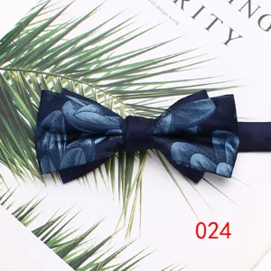 Men's dark blue double layer bow tie with elegant floral pattern for wedding and formal wear.