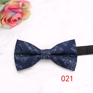 Detailed view of the dark blue men bow tie featuring abstract white texture and neat craftsmanship.
