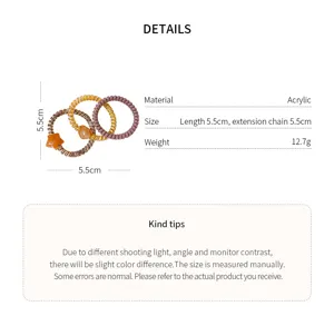 Detail view of hair ties with star charm and spiral spring design for daily styling.