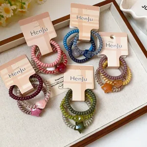 Telephone wire hair ties set with cute heart pendants, stylish sweet hair accessories.