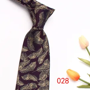 Close up of purple mens business jacquard tie with elegant gold feather pattern detail.